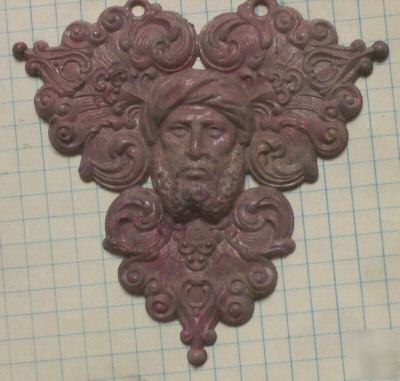 Ornate male face mold for injection molder