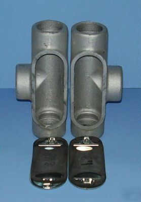 Two 1 1/2- inch conduit outlet body t's